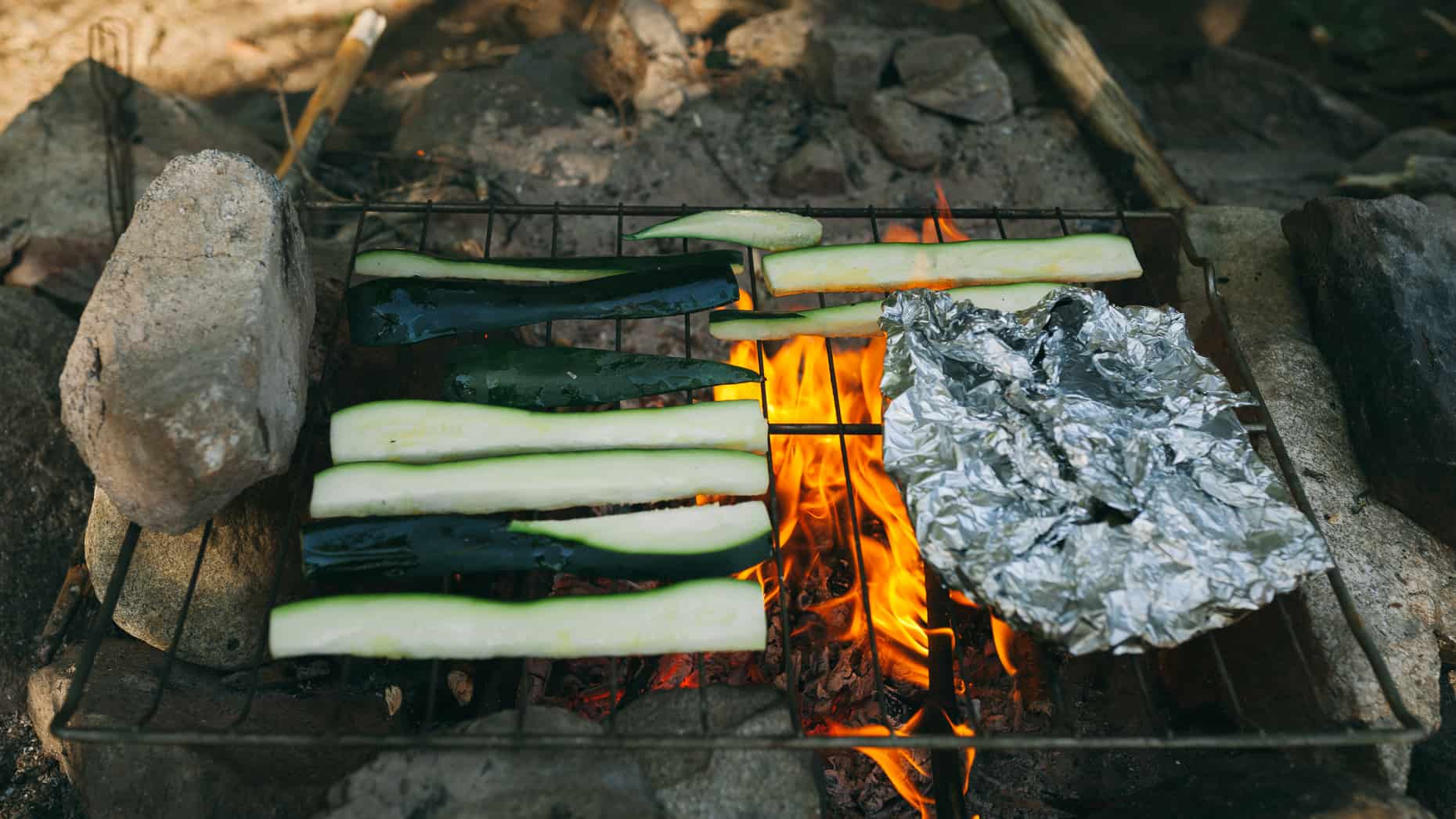 Zucchini cooking on the open fire.